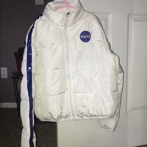 A white “NASA” coat blue stripe down the side